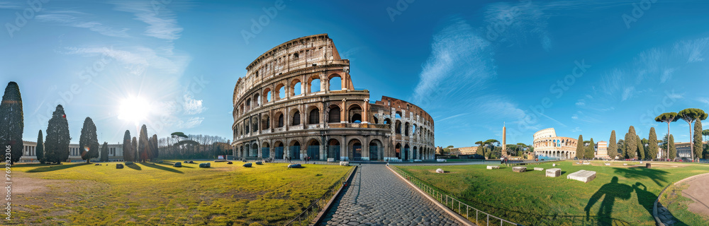 panoramic view of the Colosseum and Arch of Constantine in Rome, Italy with green grass on a sunny day