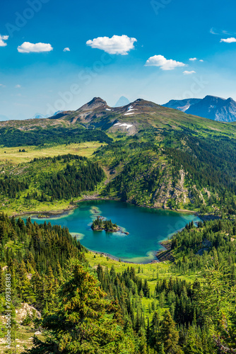 Beautiful landscape of Canadian Rocky Mountains; Sunshine Village, Banff National Park; beautiful mountain lake surrounded by green meadows and forest