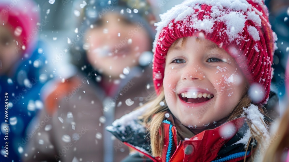 A young girl smiling while standing in the snow, joyful and carefree A young girl smiling while standing in the snow, joyful and carefree