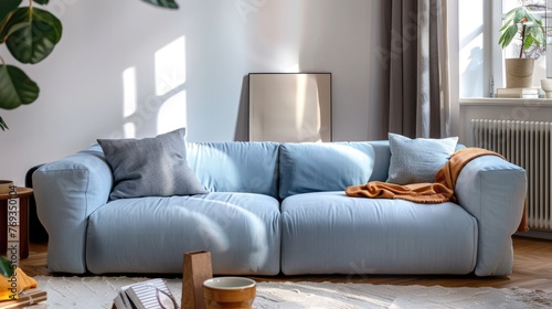 There is a Scandinavian style sofa in the middle of the room, the sofa is light blue, 