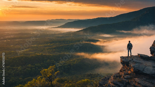 Man standing on top of mountain 