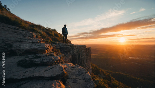 Man standing on top of mountain 