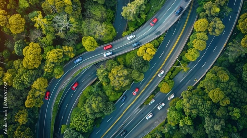 A birds eye view of a winding highway with rows of cars flowing seamlessly along its curves. The flexibility of the traffic pattern allows for a smooth and efficient flow