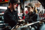 A man and woman are seen discussing and working on a car in a garage setting, focusing on car parts