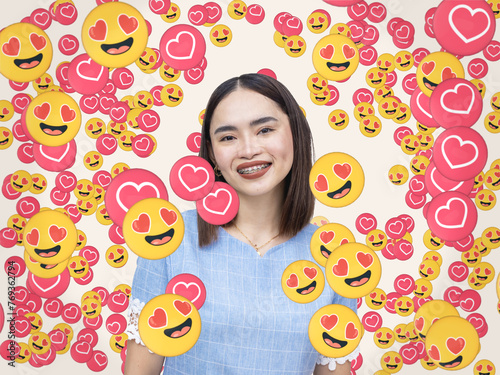 Obraz na plátně A popular female fashion influencer garnering love and heart eye emojis signifying overwhelming fan affection and support online or on social media platforms