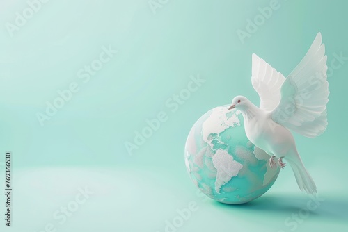 A white dove is perched on top of a globe