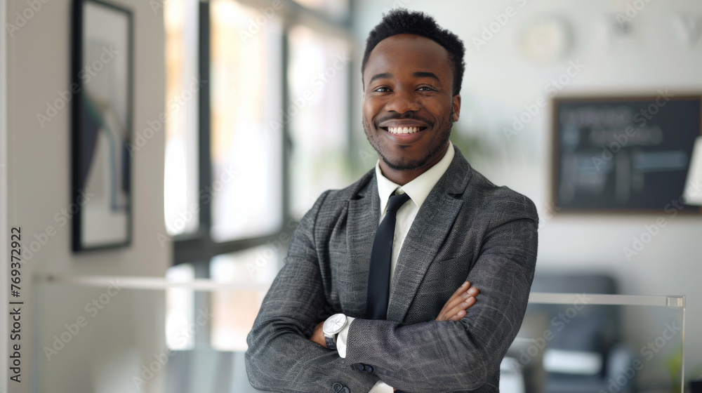 Smiling elegant confident young professional black afro american business man , male proud leader, smart businessman lawyer or company manager executive looking at camera standing in office