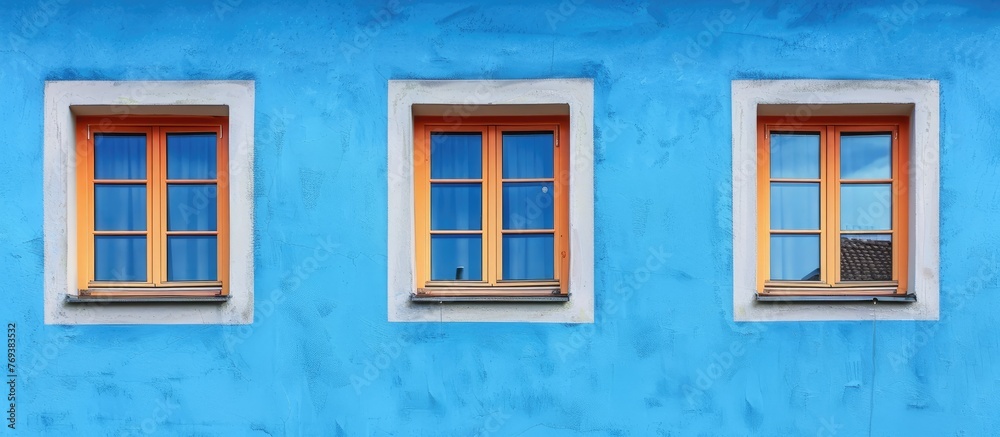 windows on a wall with blue background