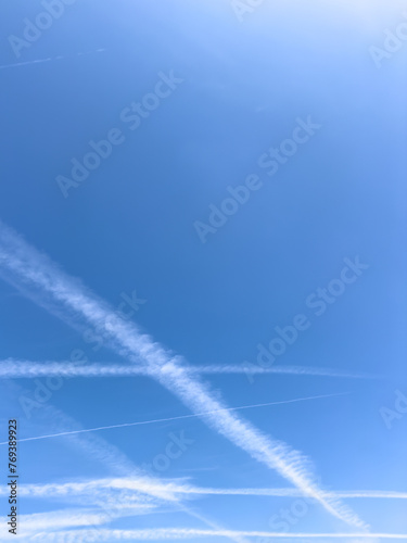 airplane vapor trails in the sky