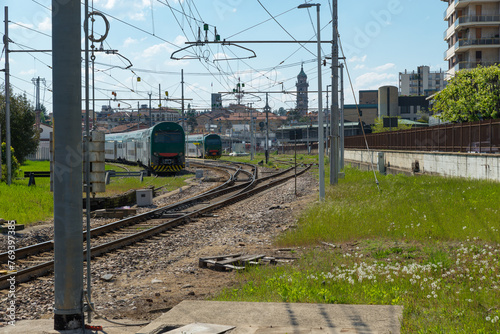 Varese city and train station, Italy, railway line. Skyline of the city of Varese and the train station along the Laveno - Milan route, Lombardy, north Italy. Panorama towards the city center photo