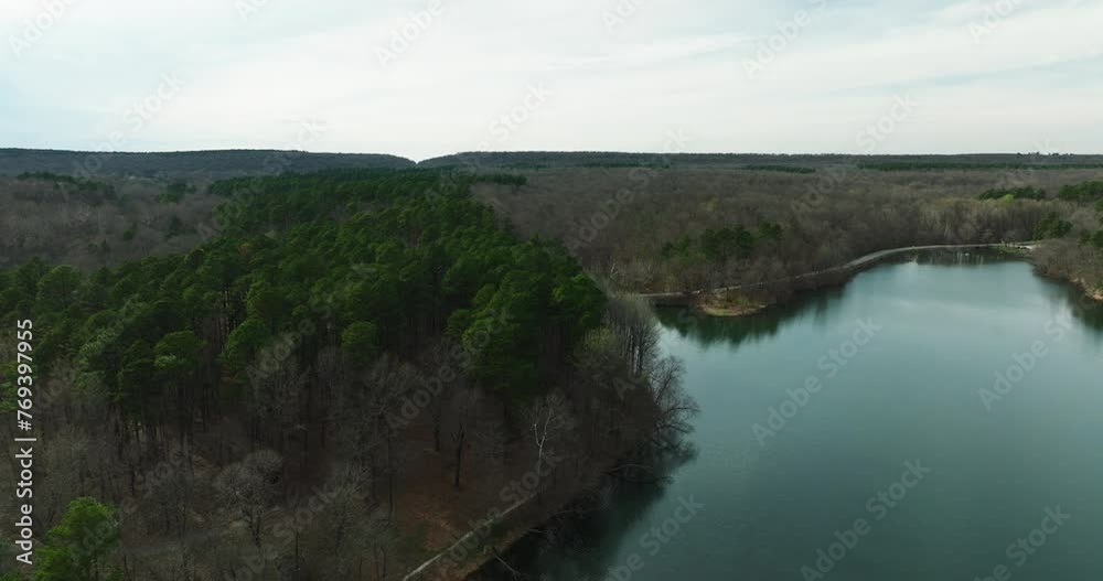 Aerial shot of Lake Wedington surrounded by forest in Arkansas, tranquil and serene Aerial shot of Lake Wedington surrounded by forest in Arkansas, tranquil and serene