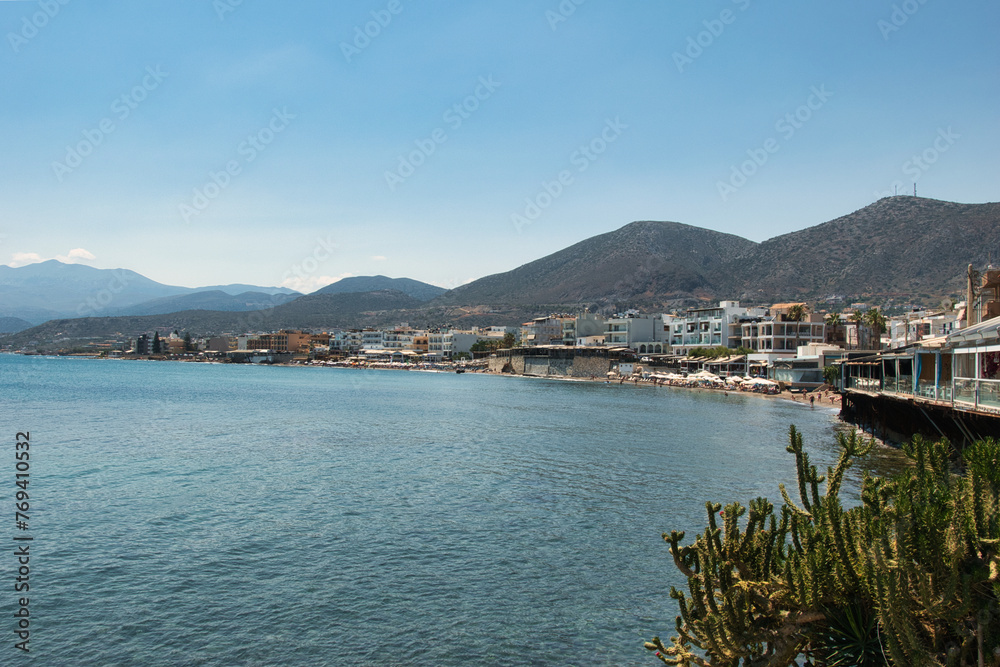 HERSONISSOS, GREECE - 22 JUNE 2023: Beach in Sarantaris village, municipal division Hersonissos. Hersonissos - a city in the north of Crete, located between the Mediterranean and Aegean seas.