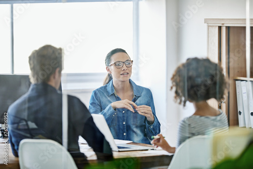 Meeting, communication and team collaboration with business people in public relations discussion. Planning, table and female employee with staff in training with advice and conversation at a company