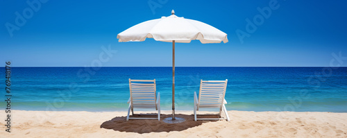 Chairs and parasol on the tropical beach