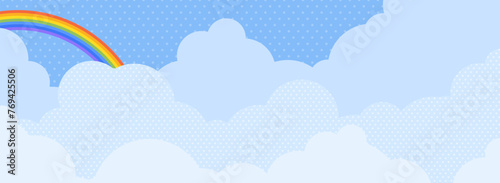 虹のかかった青空と雲の背景（バナー向け横長）