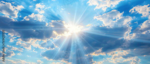 Captivating blue sky with fluffy clouds, bathed in sunshine and adorned with radiant sunbeams and rays. Perfect backdrop for design projects, exuding tranquility and natural beauty.