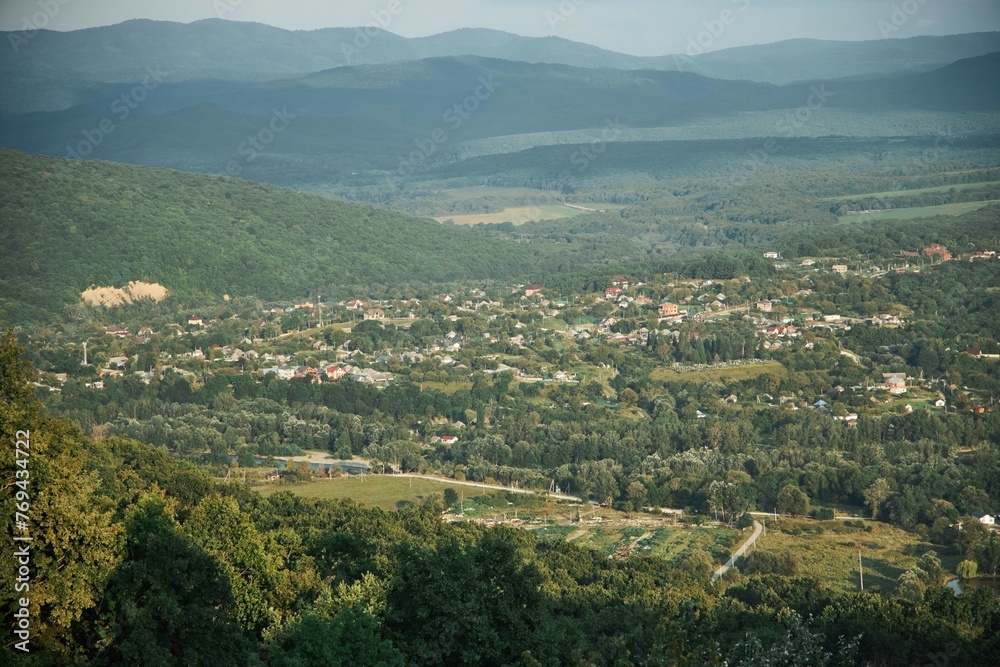 Mountain landscape. View from a high point of the village located in the valley.