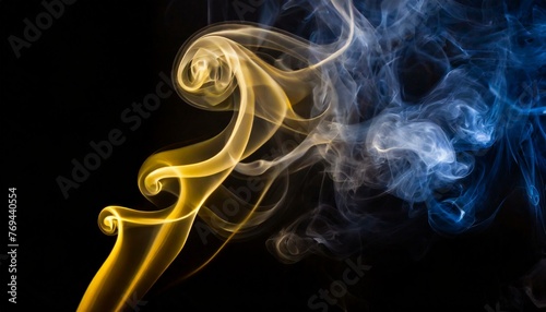 abstract yellow and blue smoke on solid black background © Viktorija