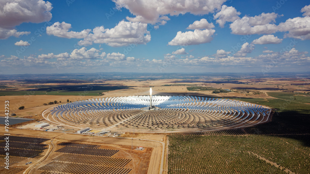 Aerial drone view of Gemasolar Thermosolar Plant. Solar energy. Green energy. Alternatives to fossil fuel. Environmentally friendly. Concentrated solar power plant. Renewable energy.