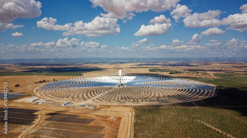 Aerial drone view of Gemasolar Thermosolar Plant. Solar energy. Green energy. Alternatives to fossil fuel. Environmentally friendly. Concentrated solar power plant. Renewable energy.