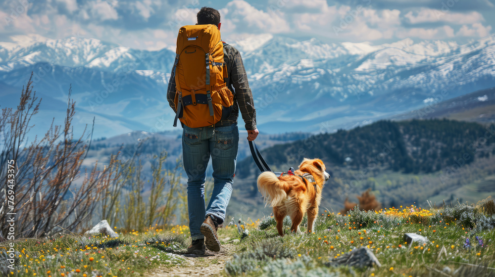 Man hiking with a dog in the mountains, exhibiting adventure, companionship, and outdoor exploration