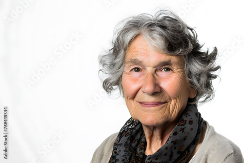 Closeup smiling grandmother , 60+ years, looking at the camera, white background © Oksana