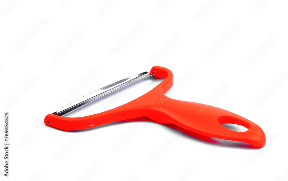 Slicing potatoes. Potato peeler. on a white isolated background. Slicer. Professional vegetable peeler for chefs with a sharp knife or stainless steel blade. Kitchen utensils for the kitchen.. Slicing potatoes. Potato peeler. on a white isolated background. Slicer. Professional vegetable peeler for chefs with a sharp knife or stainless steel blade. Kitchen utensils for the kitchen..