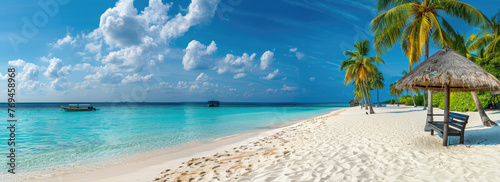 A panoramic view of the white sandy beach in Maldives, with palm trees and thatched umbrellas on either side © Kien