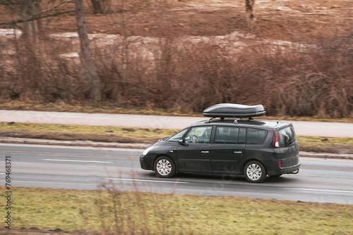 Road-Ready Comfort  Car Equipped with Roofbox for Extended Trips