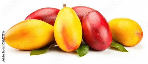 A bunch of mangoes with leaves  a staple food and superfood  displayed on a white background. These natural foods are rich in vitamins and minerals