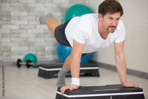 young man workout in fitness club