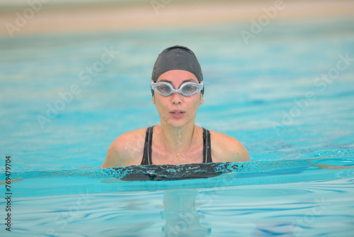 close up of woman swimming in the pool © auremar