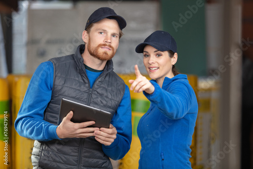 male and female workers preparing home insulation