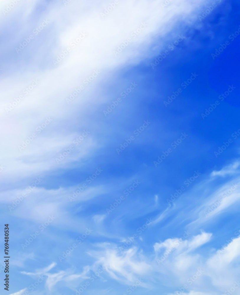 Obraz premium Blue sky with white clouds. Vertical orientation, background