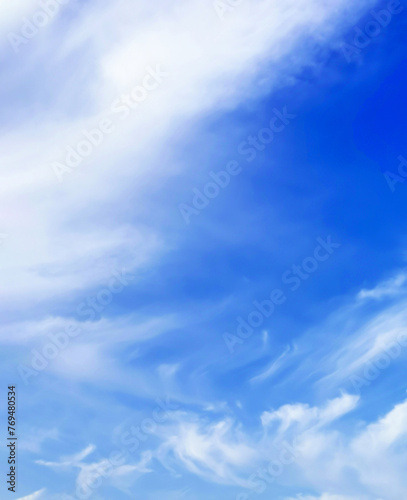 Blue sky with white clouds. Vertical orientation  background