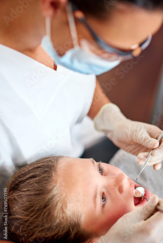 Mirror, dentist and woman with child for exam, healthcare or orthodontics for teeth in clinic. Dental hygiene, kid and doctor with tools for patient, oral or cleaning mouth with medical pediatrician