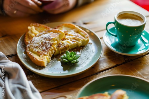 person with french toast, small succulent on table, bright coffee cup