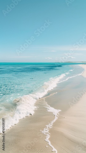 A sandy beach with waves rolling in from the ocean onto the shore  background  wallpaper