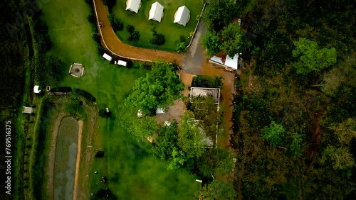 Sky-high view of river, highway, and road amidst nature's greenery