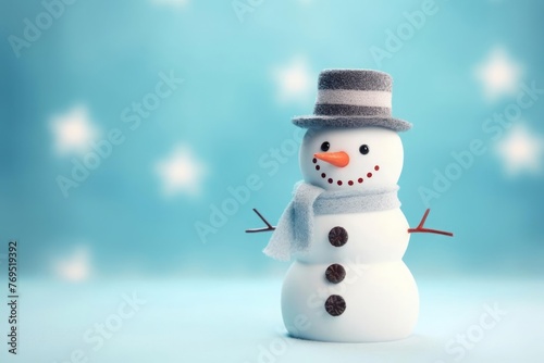 A snowman on a pastel blue background. Creative winter concept. © DK_2020