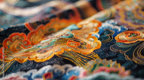 Macro shot of exquisite ornate fabric with embroidered swirl patterns in rich colors