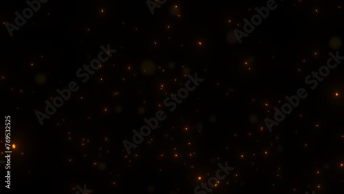 background of fire ash flying in the air black background	 photo