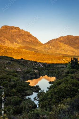 landscape with mountains reflected in a lake photo