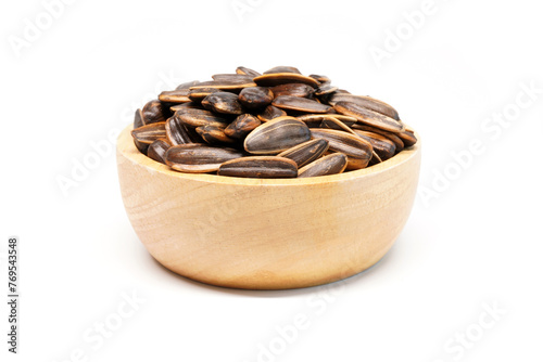Sunflower seed in wooden bowl isolated on white background