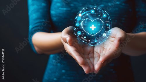 Hands holding a glowing health insurance symbol. Healthcare and medical welfare concept. Design for healthcare services and medical insurance articles with copy space. Conceptual composition