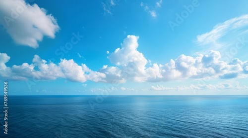 A breathtaking front view of the morning sky, painted in bright blue and adorned with clear white clouds