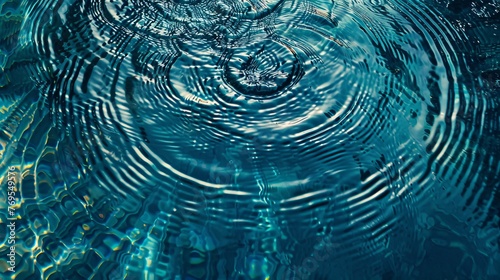 A mesmerizing top view closeup of blue water rings forming circle reflections