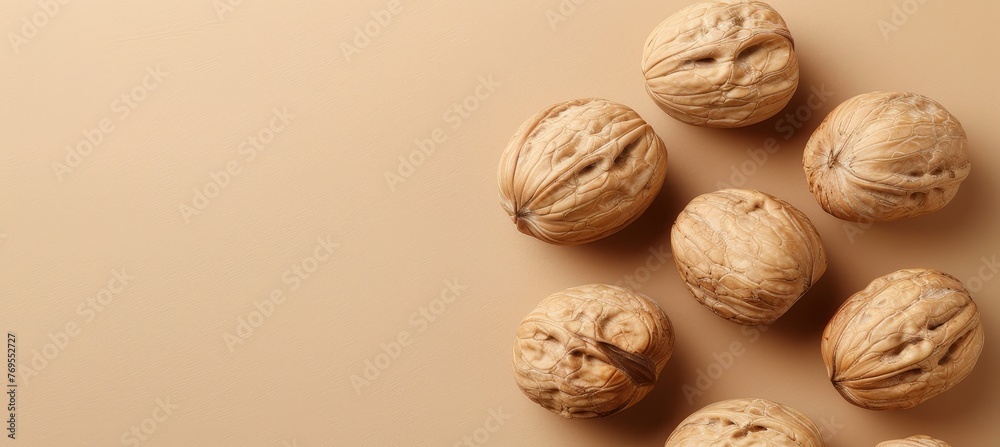 Assorted nuts on neutral background with ample space available for personalized text placement Assorted nuts on neutral background with ample space available for personalized text placement