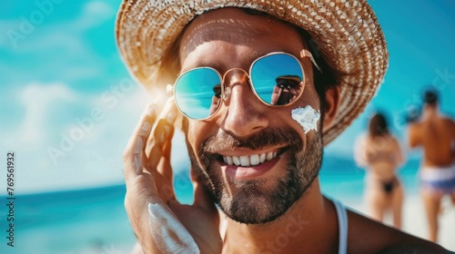 A smiling and relaxed beachgoer is shown carefully applying sunscreen to their skin,preparing to enjoy a day of leisure and recreation on the beautiful,sun-drenched beach photo