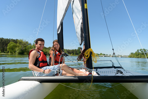 a couple in a a sailboat